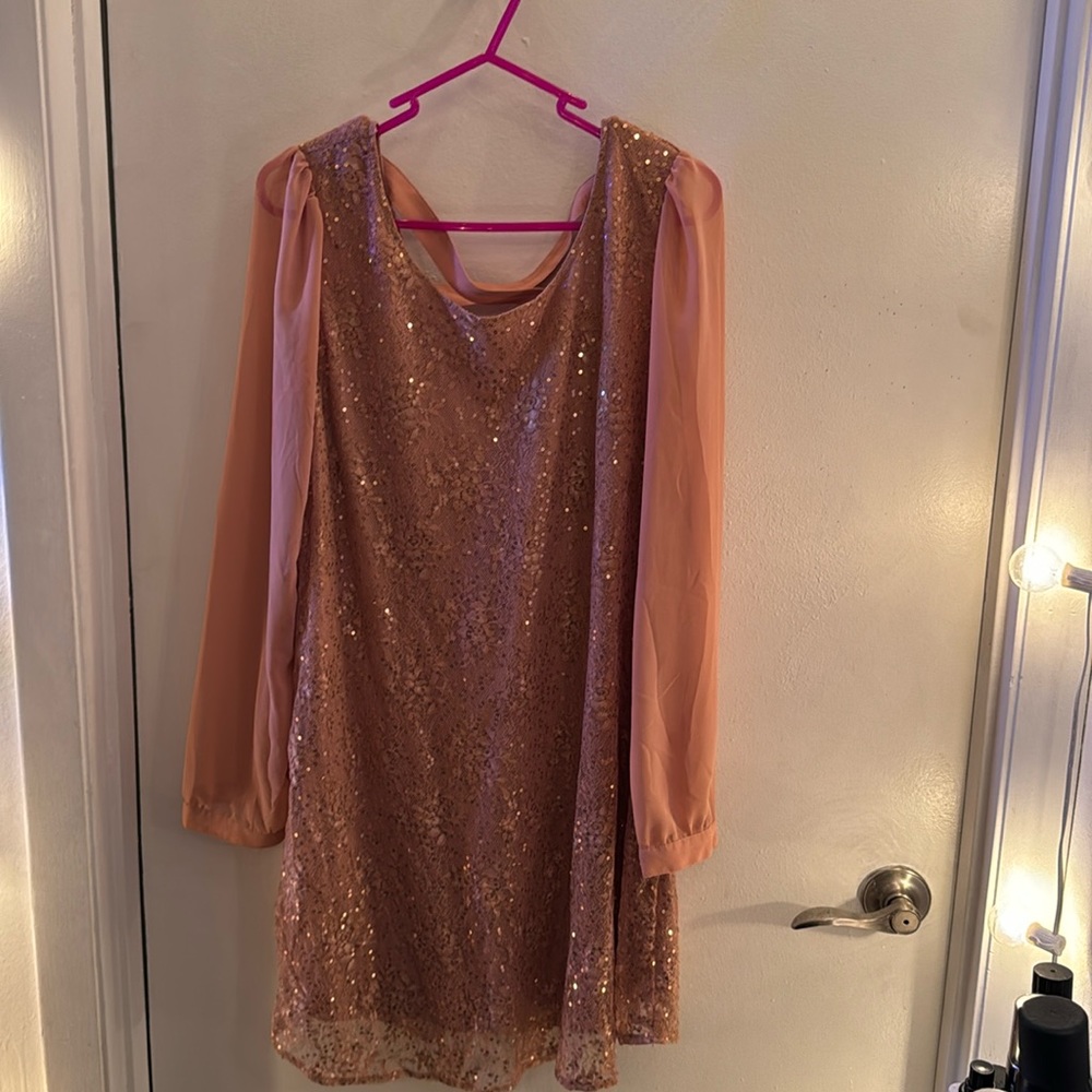 Coral/rust colored sequined and lace long sleeve dress with criss cross back